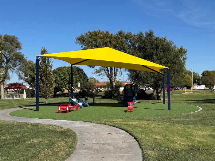 Outdoor exercise equipment under a shade