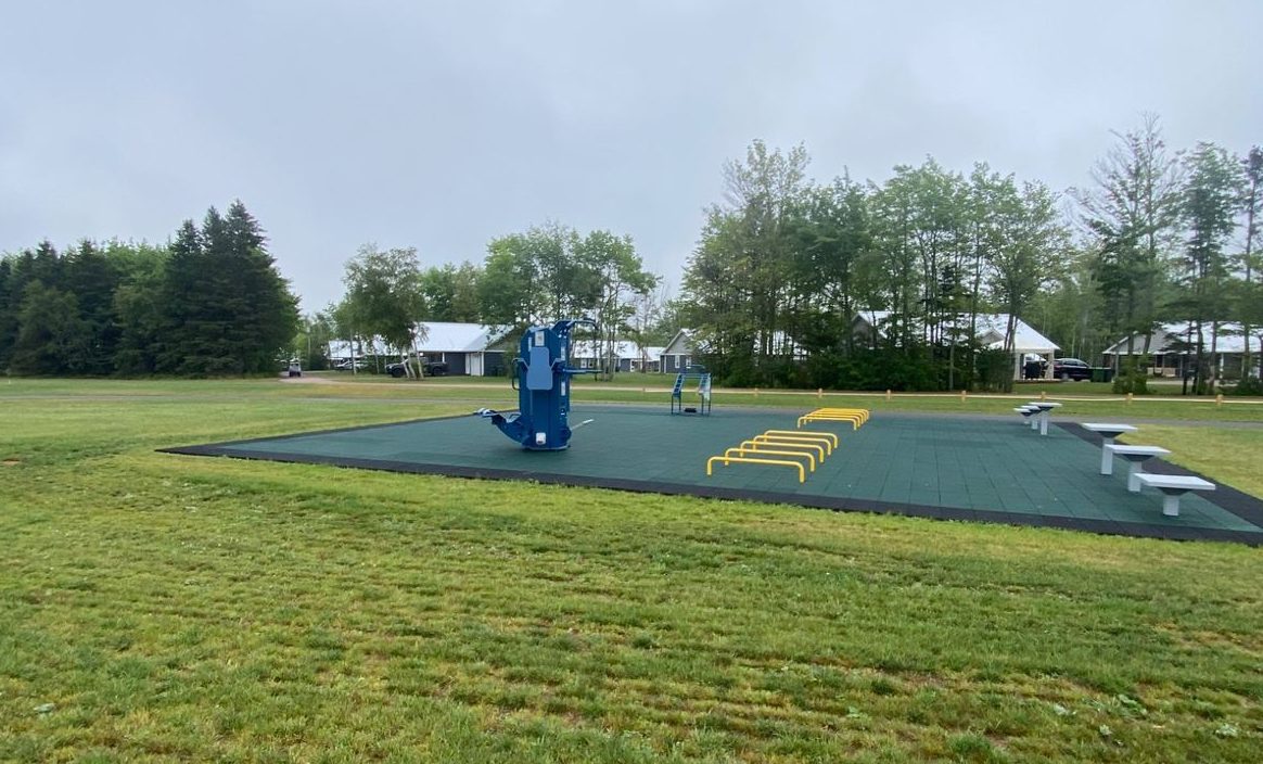 Two outdoor gym pads along a 600-meter paved walking track beside PEI’s first artificial turf baseball field. 