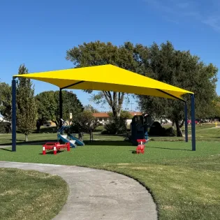 public fitness equipment under a shade
