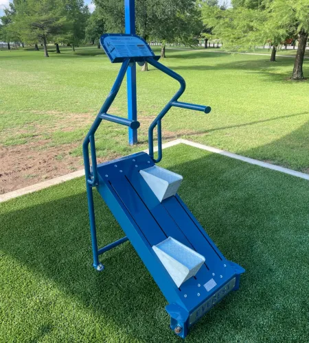 Outdoor-Fit Everest Cardio Climber with overhead shade structure at Chisholm Park outdoor gym.