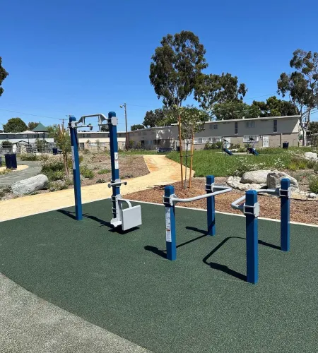 Outdoor calisthenics rig at a Los Angeles Housing Authority community fitness area